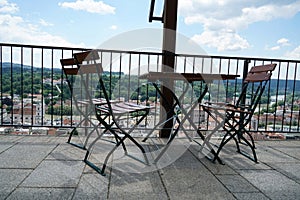 Benches and chairs at tables invite you to relax and unwind