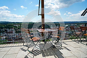 Benches and chairs at tables invite you to relax and unwind