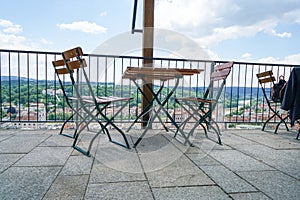 Benches and chairs at tables invite you to relax and unwind