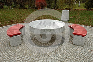 Benches and chess table in park