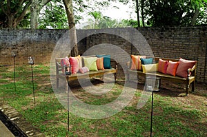 Benches with cushions in garden photo