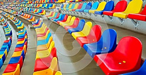 Benches of different colors in a sports stadium