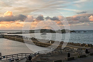 Benches at the dock, with Faerder National Park in the background, view from Verdens Ende in Vestfold Norway