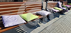 Benches with lots of cushions in different colors