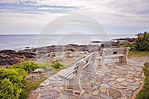 Benches on Marginal way path along the rocky coast of Maine in Ogunquit