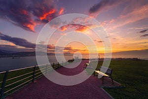 Benches in park in Getxo at sunset