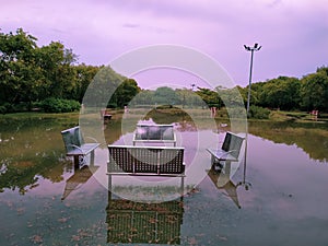 Benches of a park submerged in flooded water