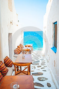 Typical Greek bar in Mykonos town with sea view, Cyclades islands, Greece