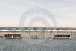 Benches on the Rockaways Boardwalk and view of the beach, in Queens, New York City