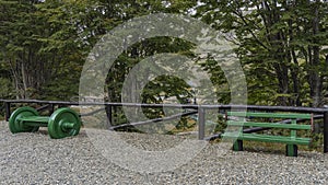 The benches stand on a platform strewn with rubble photo