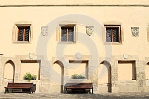 Benches and windows with crests on castle VlaÅ¡skÃ½ dvÅ¯r