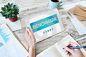 BENCHMARK, business processes and performance metrics to industry bests practices from other companies photo