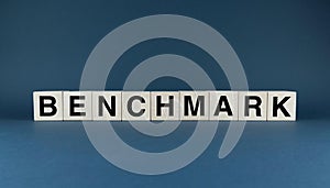 Benchmark. Cubes form the word Benchmark. Concept word Benchmark