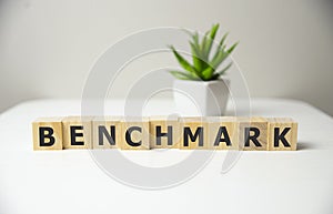 BENCHMARK word made with building blocks, process concept.