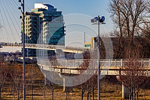 The bend in Bob Kerrey foot bridge with backdrop of River Front Condominiums Omaha Nebraska