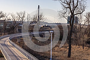 The bend in Bob Kerrey foot bridge with backdrop of River Front Condominiums Omaha Nebraska