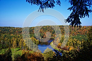 Bend of the Gauja River among the forest in Sigulda in autumn. Latvia