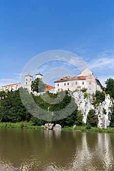 The Benedictine Abbey in Tyniec with wisla river on blue sky background