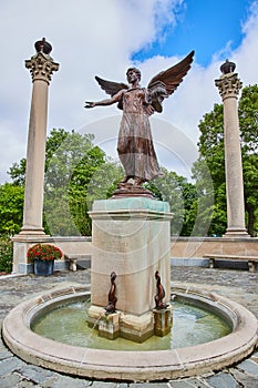 Beneficence, Benny, fountain at Ball State University by Daniel Chester French on summer day