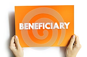 Beneficiary - person or other legal entity who receives money or other benefits from a benefactor, text concept on card photo