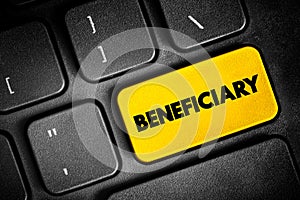 Beneficiary - person or other legal entity who receives money or other benefits from a benefactor, text button on keyboard, photo
