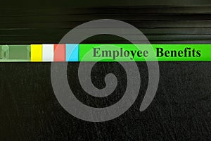 Benefits file in black binder folder. Human resources business concept.