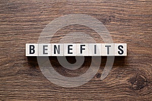 Benefits - word concept on building blocks, text