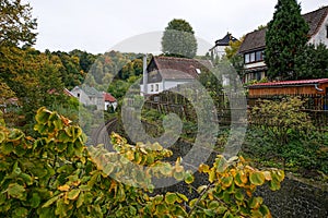 Benesov nad Ploucnici, Czech republic - September 29, 2019: houses above train track in autumn