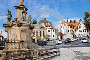 Benesov nad Ploucnici, North Bohemia, Czech Republic, 2 October 2021: Marian Column with baroque statues at main town square, old