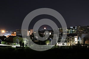 Benevento - Panorama notturno con luna sorgente photo