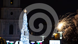 Bengal fire on the background of Sophia Square in the winter night Kiev