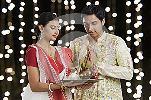 Bengali couple praying