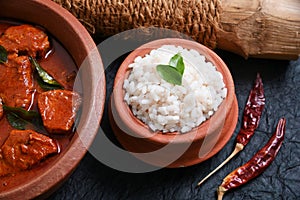 Bengali spicy red fish curry and rice, Indian fish curry