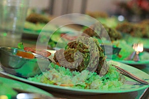 Bengali food rice pulses fish in the restaurant.