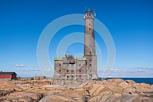 BengtskÃ¤r Lighthouse, summer view of Bengtskar island in Archipelago Sea, Finland, KimitoÃ¶n, Gulf of Finland sunny day photo