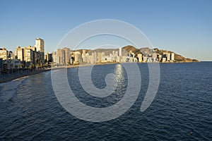 Benidorm , beach panorama and skyline at sunset.Famous vacations destination in Costa Blanca, Spain.Summer holidays background