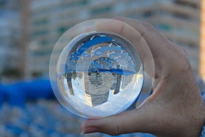 Benidorm skyscrapers seen through a crystal ball. Dream holiday.