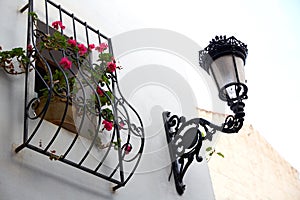 Benidorm white facade window with flowers pot