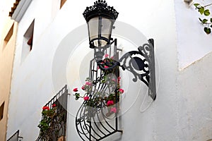 Benidorm white facade window with flowers pot