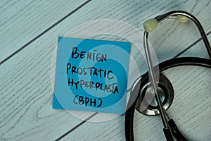 Benign Prostatic Hyperplasia BPH write on sticky notes isolated on Wooden Table. healthcare Concept