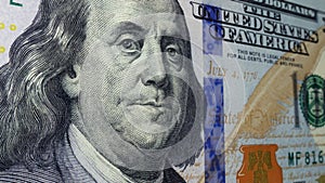 Benjamin Franklin on the $100 bill.