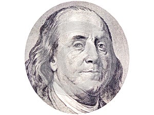 Benjamin Franklin face in ellipse on 100 dollar bill o white background.