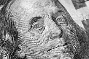 Benjamin Franklin face on us one hundred dollar bill macro isolated, united states money closeup photo