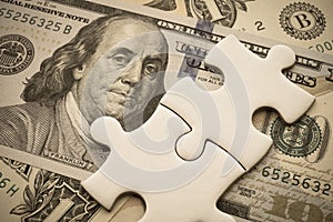 Benjamin Franklin president on US dollar banknote with jigsaw puzzle. Global world economy recession crisis situation