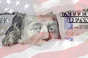 Benjamin Franklin`s eyes from a fragment of new 100 dollar with american flag background. Benjamin Franklin. Hundred dollar bill