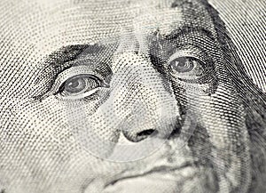 Benjamin Franklin's face on the US 100 dollar bill