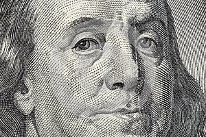 Benjamin Franklin's face on the US 100 dollar bill