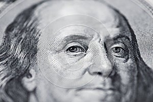 Benjamin Franklin`s look on a hundred dollar bill. Benjamin Franklin portrait macro usa dollar banknote or bill