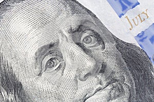 Benjamin Franklin`s stare on one hundred dollars banknote