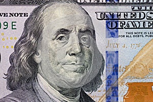 Portrait of Statesman, inventor, diplomat, and American founding father Benjamin Franklin on 100 US dollar. photo